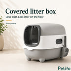 Modern grey and white enclosed cat litter box featuring a protective front door and odor-reducing covered design.