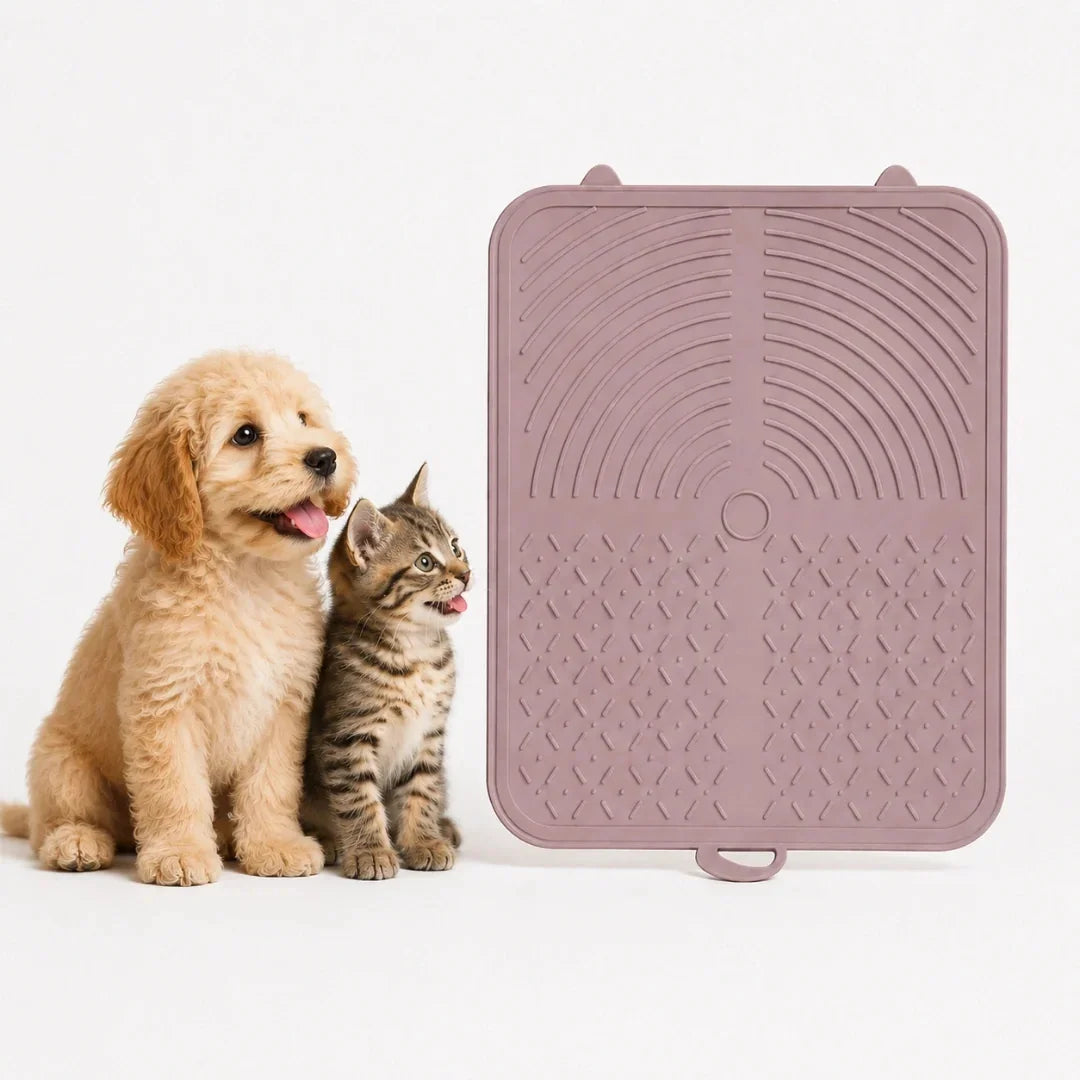 Cute puppy and kitten sitting next to a mauve Petifo silicone pet lick mat