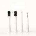 Four white replacement attachment heads for a dog electric toothbrush including two brush heads, a water flosser nozzle, and a scraper.