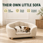 Dog resting on its own PawHut elevated pet sofa - Petifo