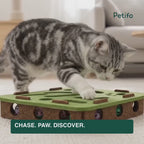 Cat playing with the concealed bell ball inside the Purrnivo felt puzzle - Petifo